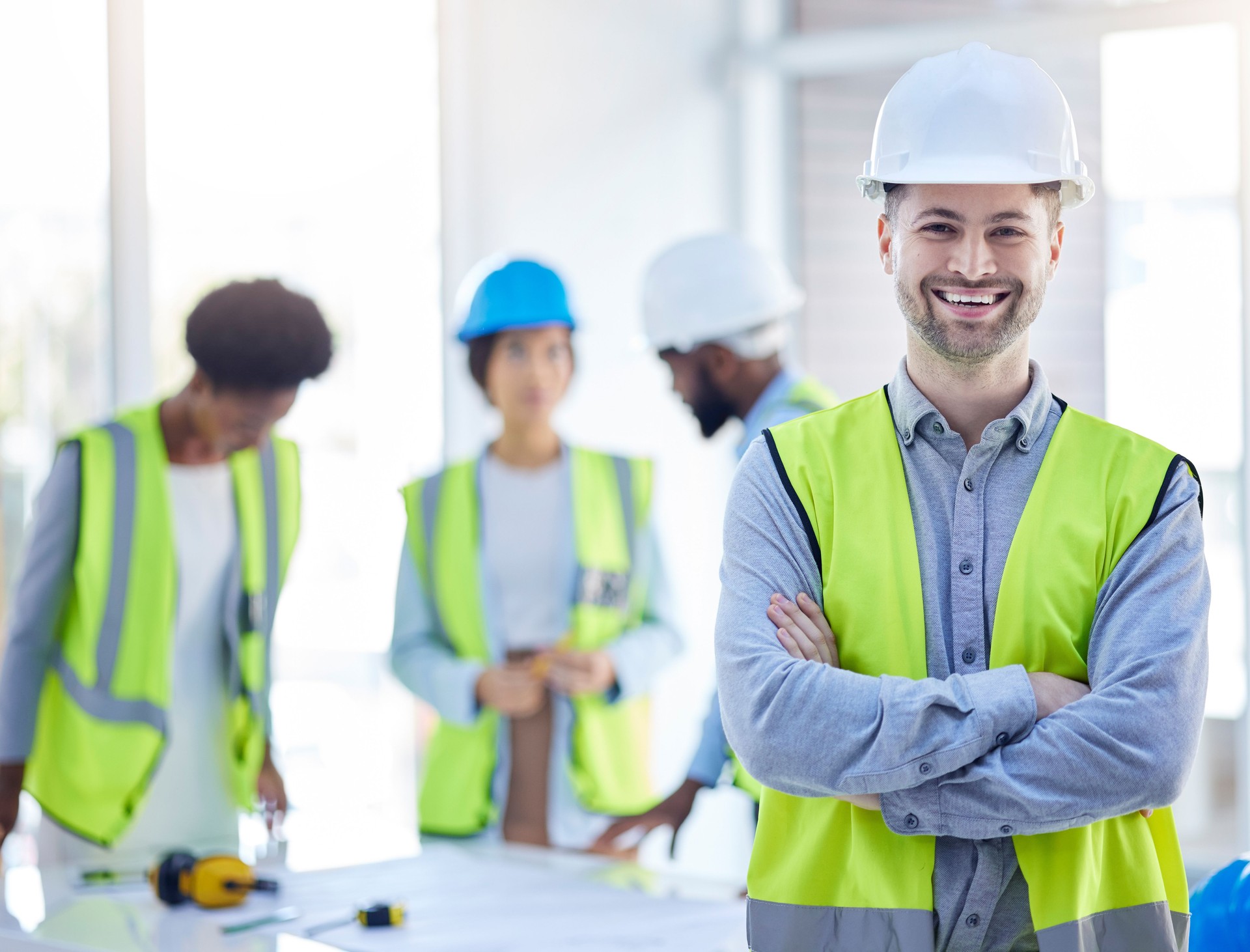Construction worker, man portrait and arms crossed of engineer, builder or contractor. Industrial, handyman gear and male person with confidence and proud from engineering and architecture project